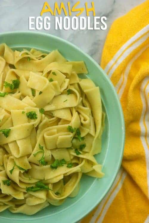 Egg noodles served in a white bowl.