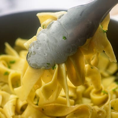 Scooping the amish egg noodles.