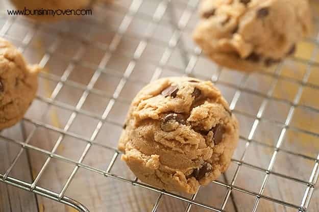 Almond butter chocolate chip cookies on a wire cooling rack.