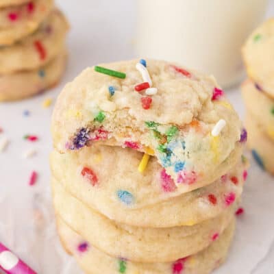 STack of sugar cookies with sprinkles.
