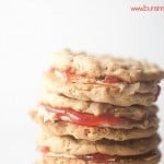 Peanut butter and jelly cookies stacked up.