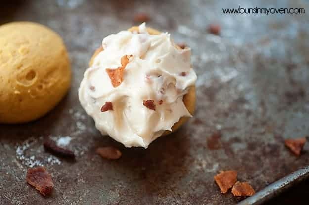 Overhead view of a pumpkin whoopie topped with maple bacon filling.