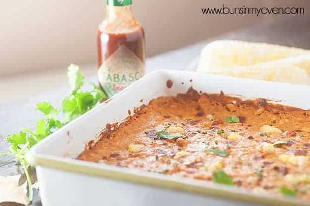 Tabasco sauce behind a pon ofo enchilada dip.