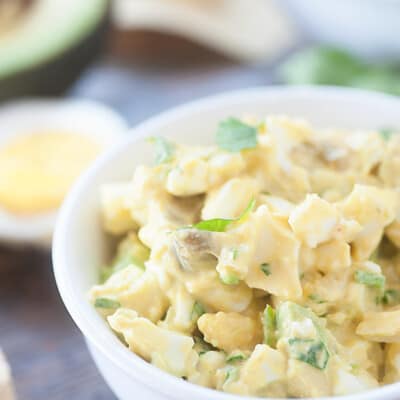 Egg salad chip dip in a small white bowl.