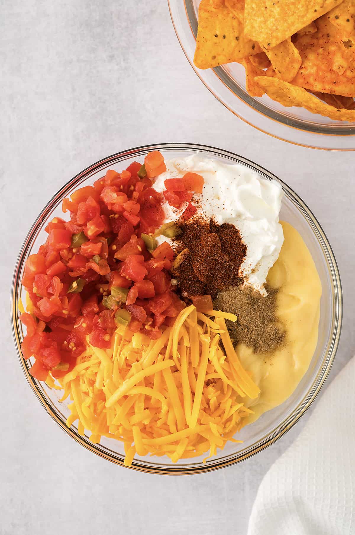 Ingredients for chicken and dorito casserole in mixing bowl.