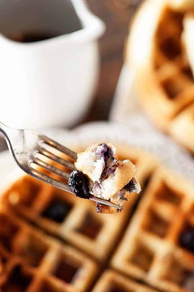 Tender blueberry muffins made in a waffle iron and covered in maple syrup!