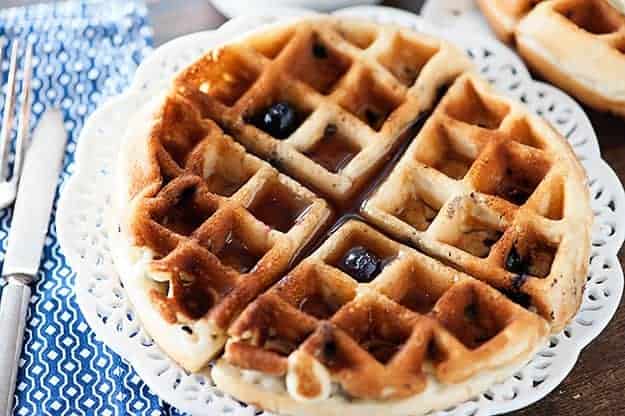 Tender blueberry muffins made in a waffle iron and covered in maple syrup!