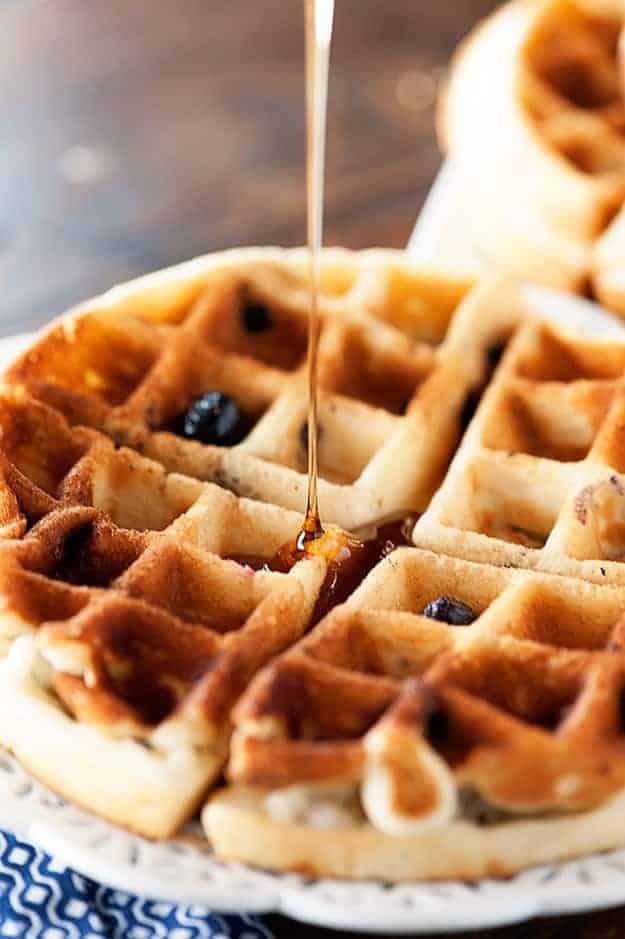 Tender blueberry muffins made in a waffle iron and covered in maple syrup!