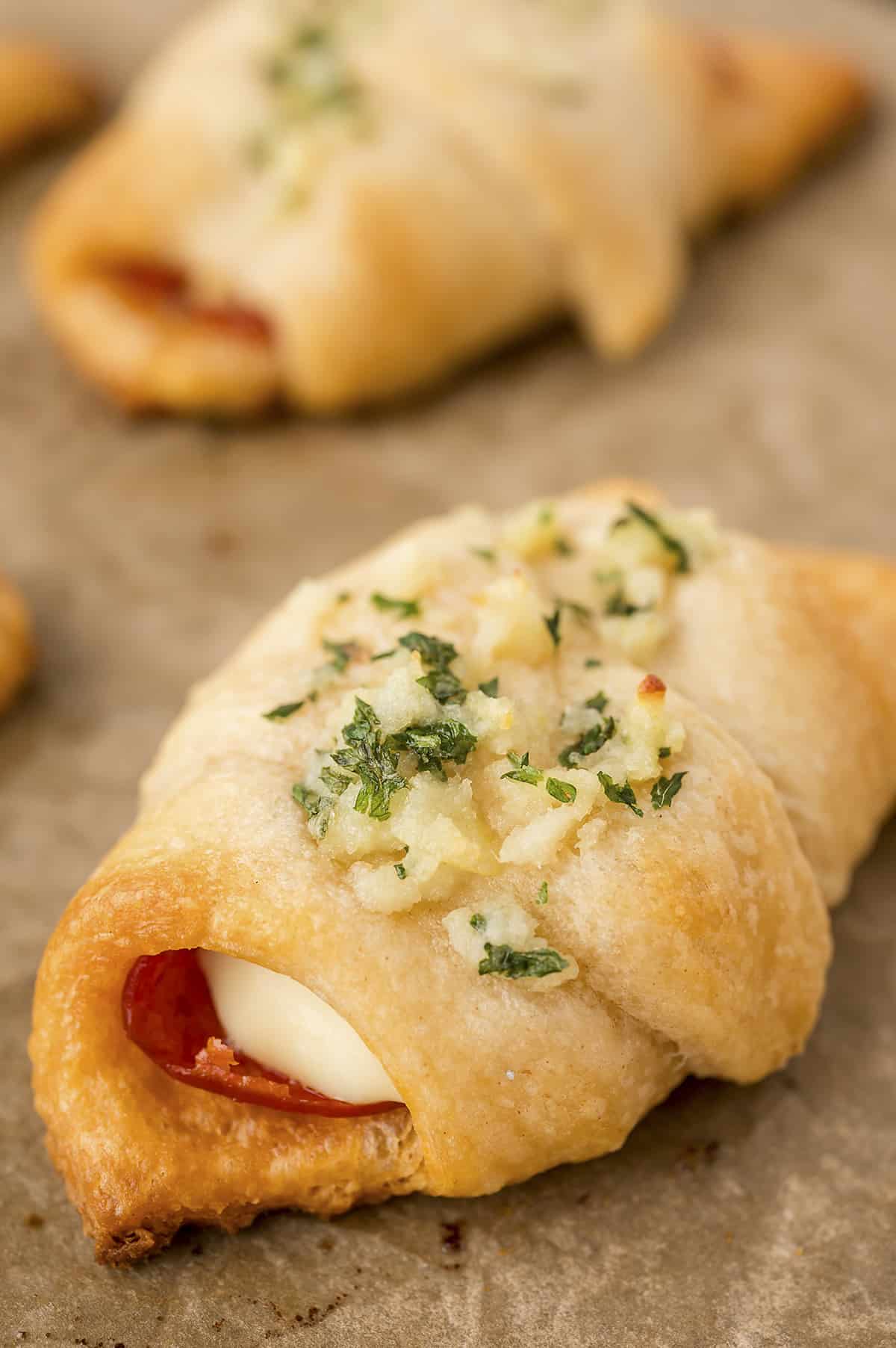 Pizza roll on baking sheet.