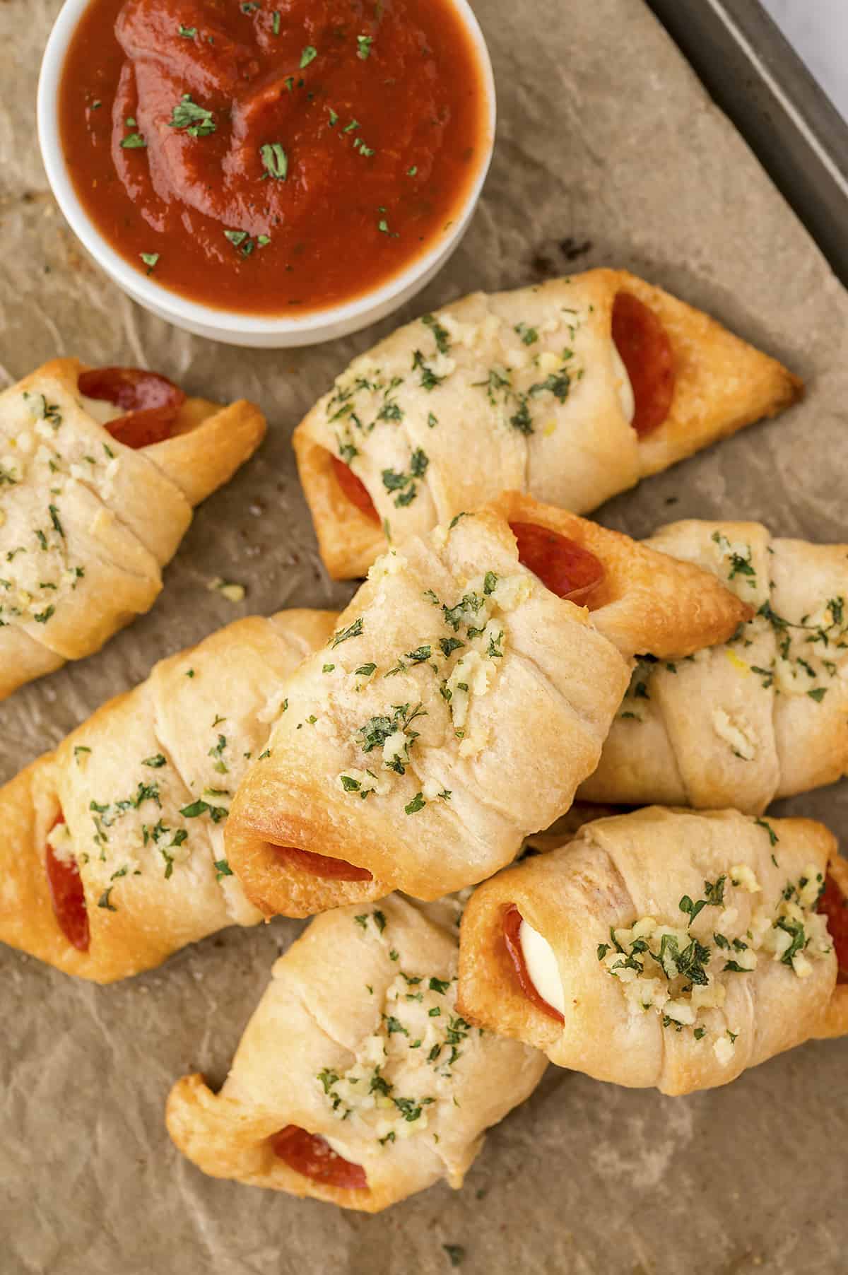 These homemade pizza rolls are stuffed with pepperoni and mozzarella cheese for a quick lunch or easy snack!