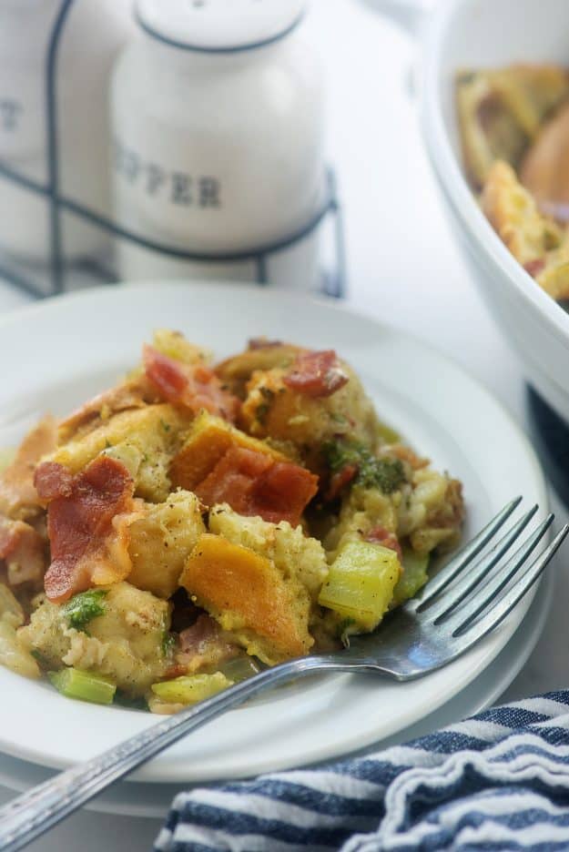 bacon stuffing on plate with fork and napkin.