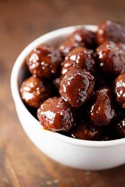 grape jelly meatballs in white bowl.