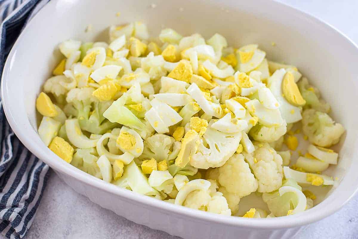 cooked cauliflower and eggs in mixing bowl.