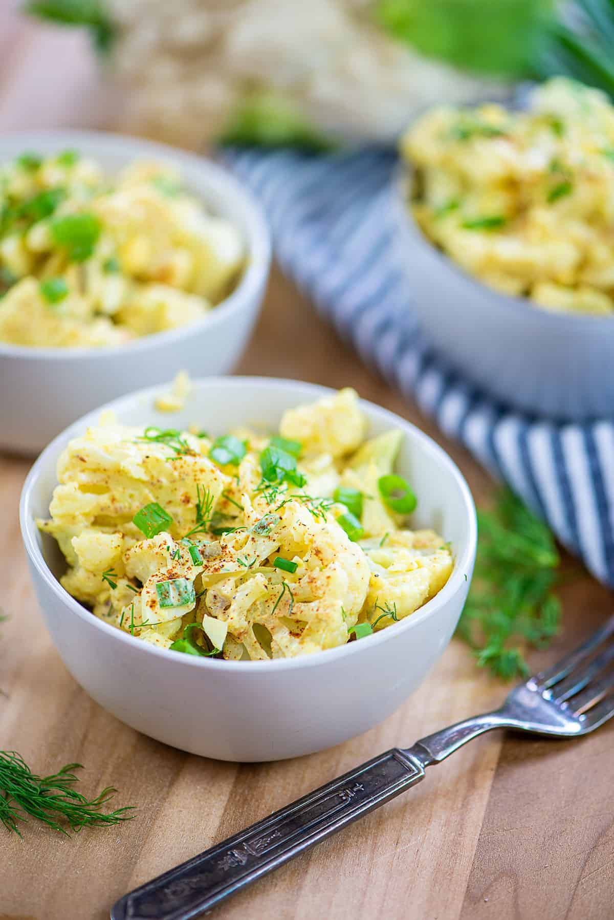 keto potato salad in small bowls.