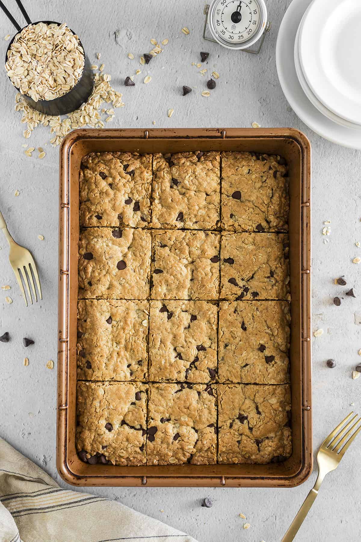 Overhead view of sliced oatmeal cookie bars in baking dish.