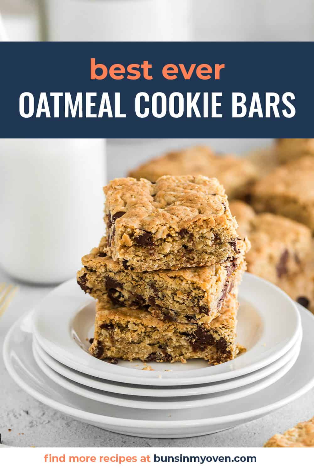 Stack of oatmeal cookie bars next to glass of milk.