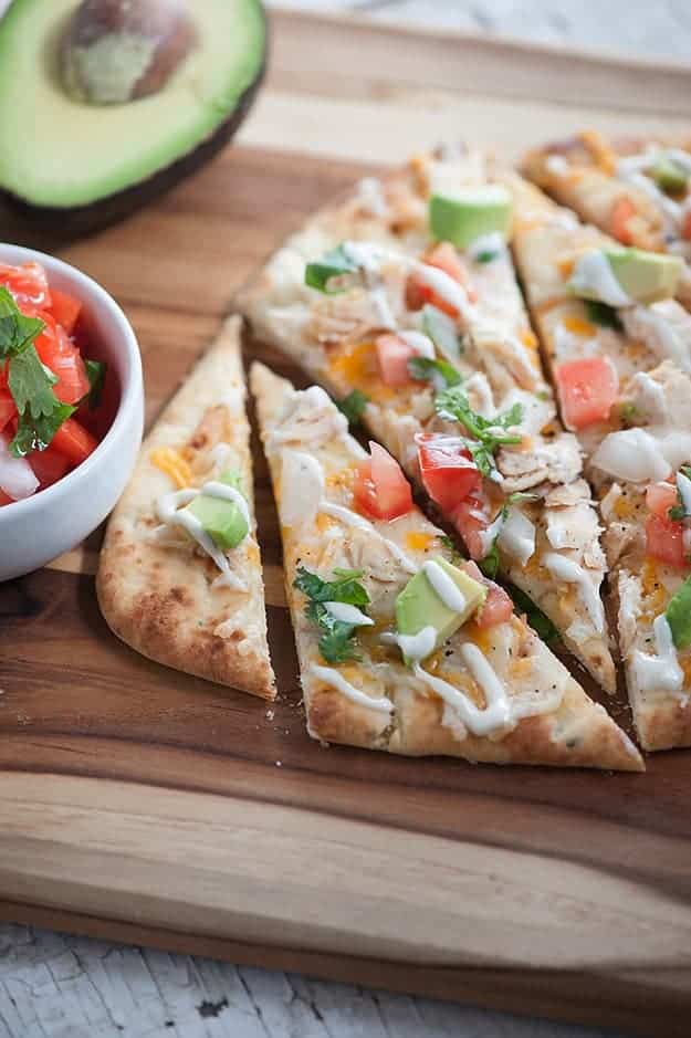 This quick and easy dinner recipe is ready in just 20 minutes! Mexican Chicken Flatbread... healthy, quick, and loaded with chicken, cheese, and pico de gallo! 