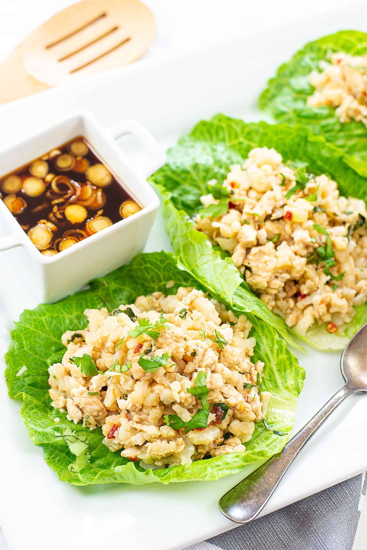 lettuce wraps on white plate.