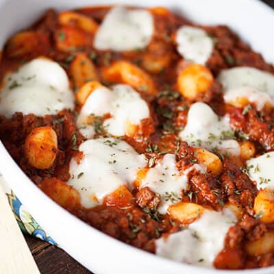 A plate of gnocchi casserole with melted cheese on top.