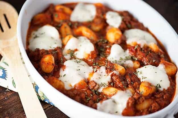 A plate of gnocchi casserole with melted cheese on top.