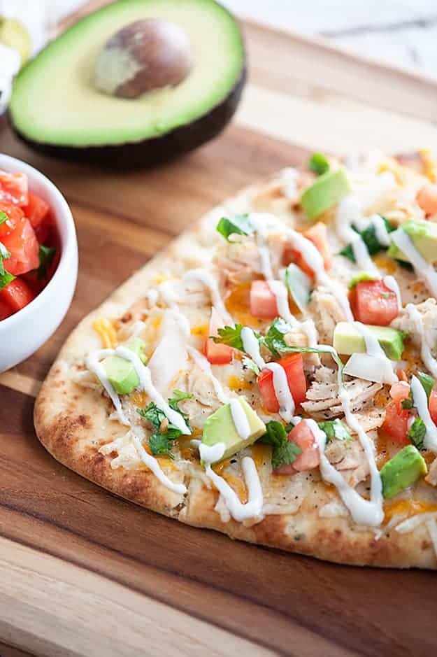 This quick and easy dinner recipe is ready in just 20 minutes! Mexican Chicken Flatbread... healthy, quick, and loaded with chicken, cheese, and pico de gallo!