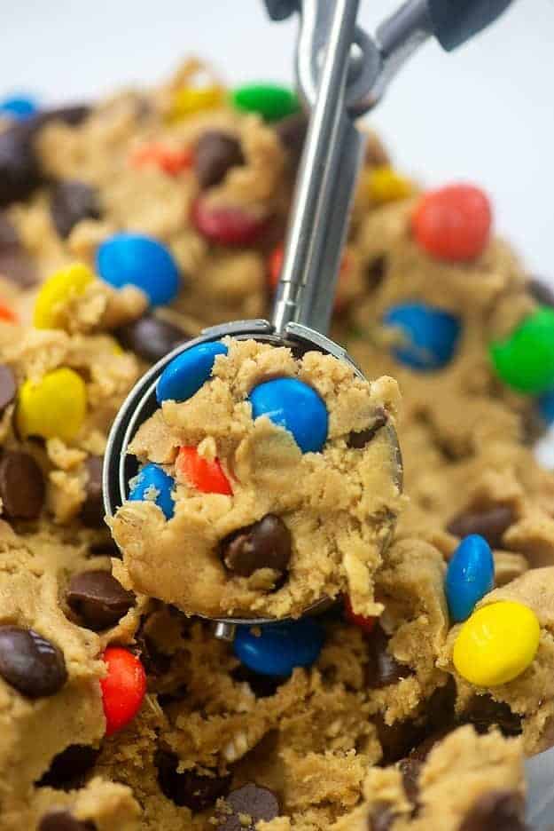 a scoop of peanut butter cookie dough with m&m's