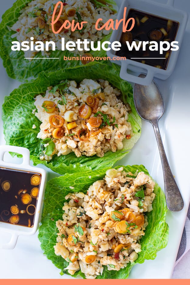 chicken wraps made with lettuce on white plate.