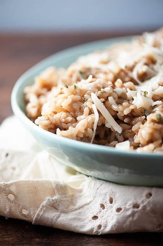 A bowl of rice on a decorative cloth napkin.