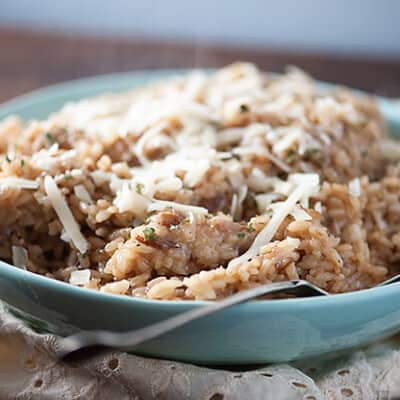 A side view of rice in a white bowl.