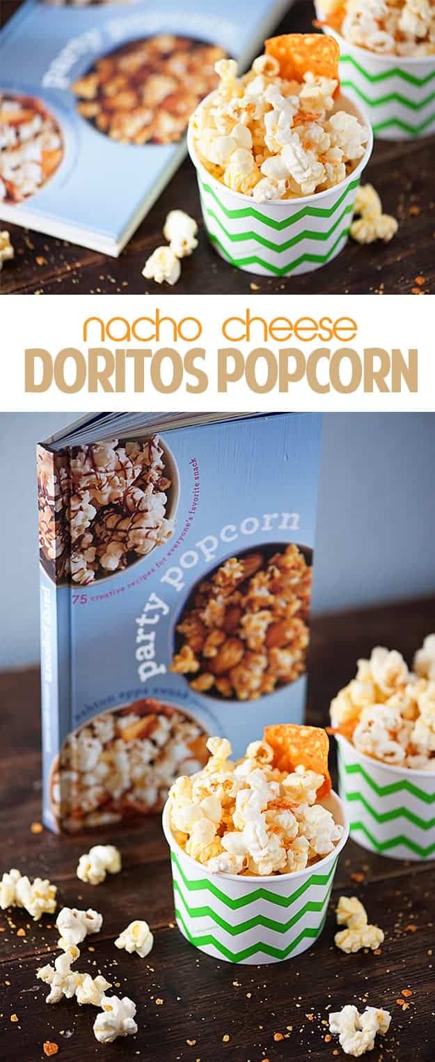 A popcorn cookbook behind a couple of paper cups of cheesy popcorn.