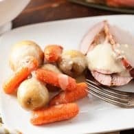 Roast pork sirloin with veggies and garlic gravy! A healthy dinner recipe that's ready in just over an hour.