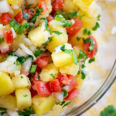 potato salad with pico de gallo in glass bowl.