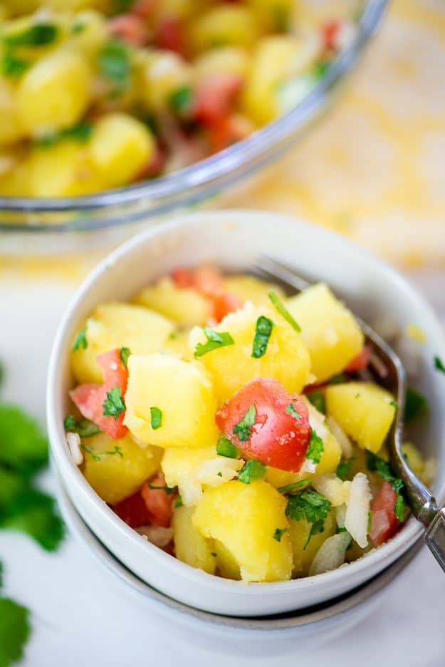 Mexican potato salad in white bowl.