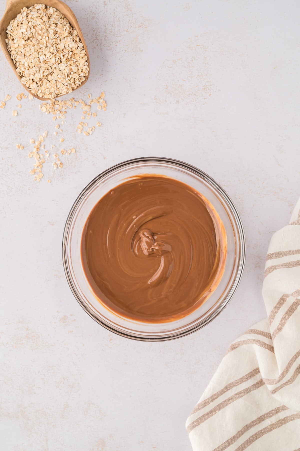Chocolate chips and peanut butter melted together in mixing bowl.