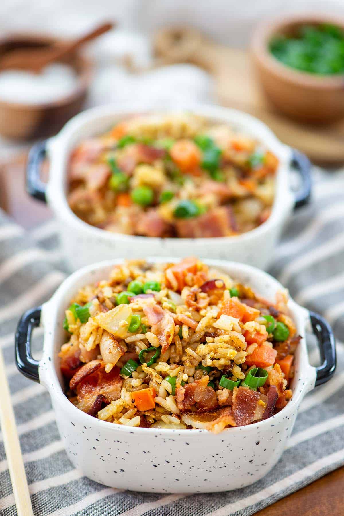 bacon fried rice in small white dishes.