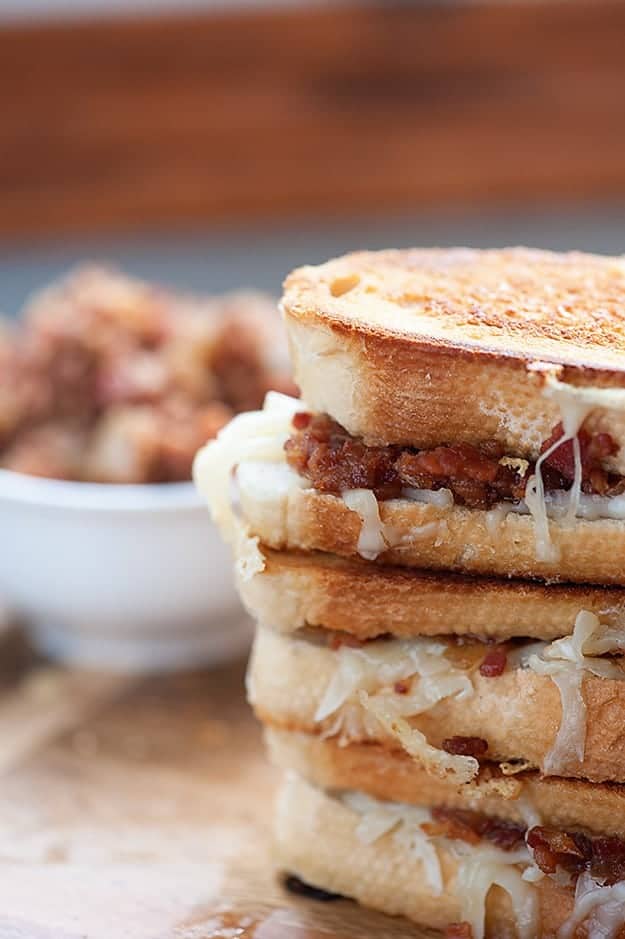 A close up of a few stacked up bacon jam sandwiches.