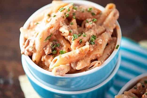 Pasta in a small blue bowl.