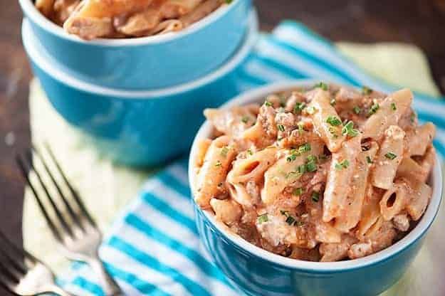 Two bowls of million dollar pasta on a table.