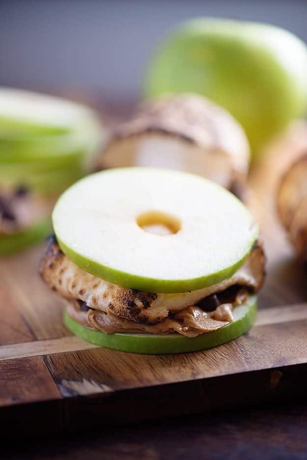 S'mores made with apple slices, peanut butter, and chocolate chips! 