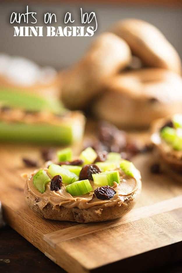 Small bagel topped with raisins and celery.