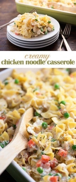 A cop up view of a chicken noodle casserole with a wooden spoon in it.