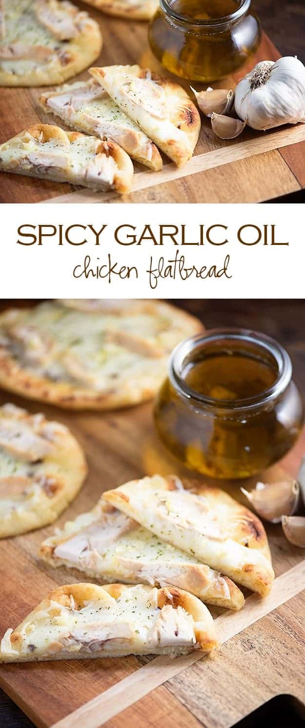 Garlic flatbread on a cutting board with a jar of  garlic oil.