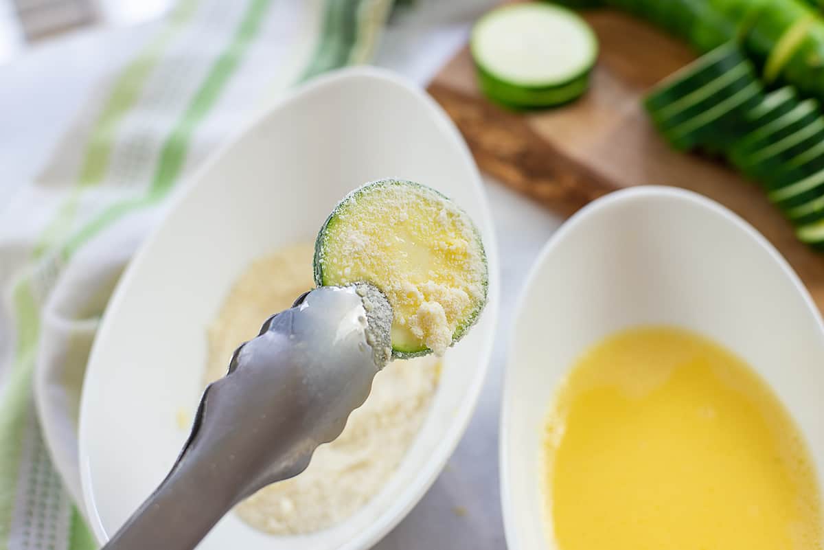 zucchini dipped into low carb breading mixture.