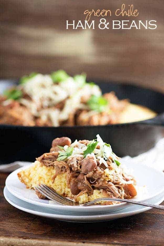 Slow cooker pork and beans! This is a cheap and easy slow cooker dinner that's perfect over cornbread. We love this for Mexican night!