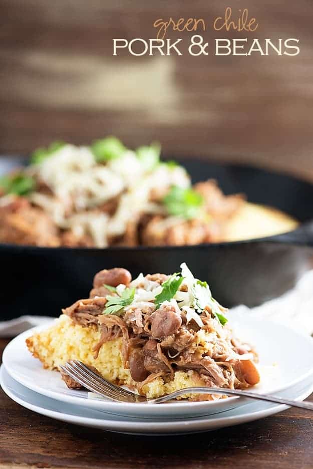 Slow cooker pork and beans! This is a cheap and easy slow cooker dinner that's perfect over cornbread. We love this for Mexican night! 