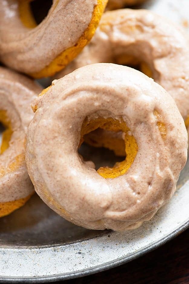 Baked pumpkin donuts with browned butter glaze! These easy donuts are full of pumpkin and topped with an amazing glaze!