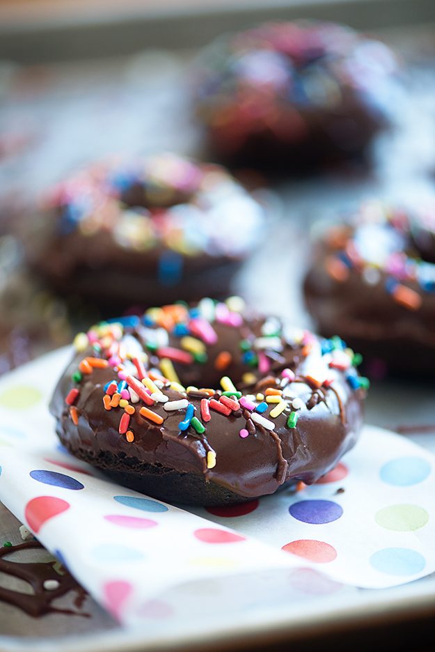 A close up of a decorated donut on a plate