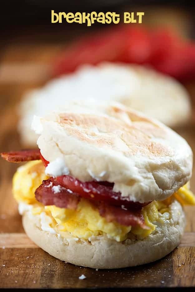 A close up of a biscuit with eggs and bacon in it 