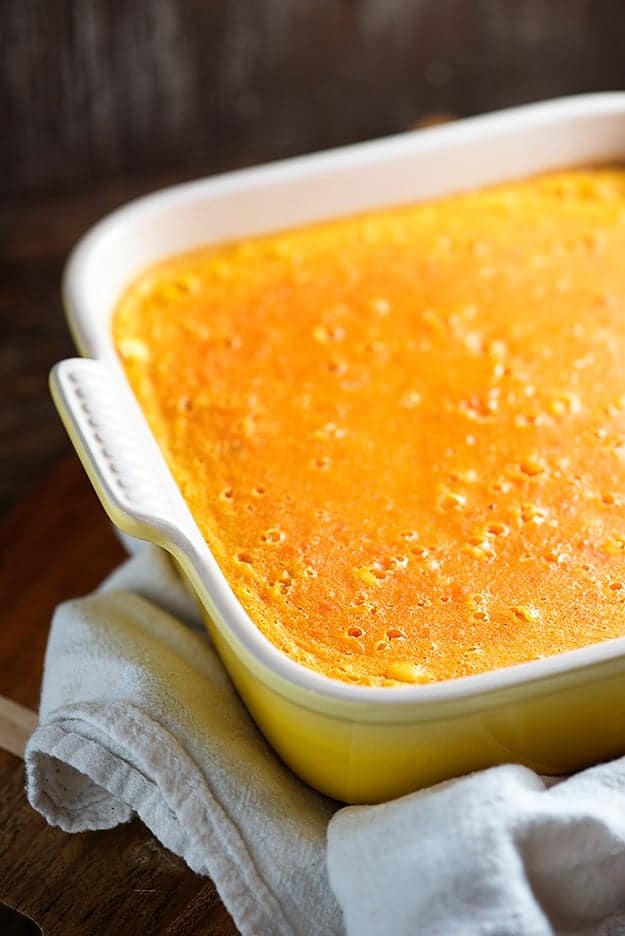 Carrot custard in a square baking dish.