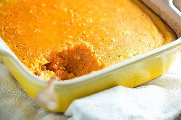 A close up of a square baking pan of custard 